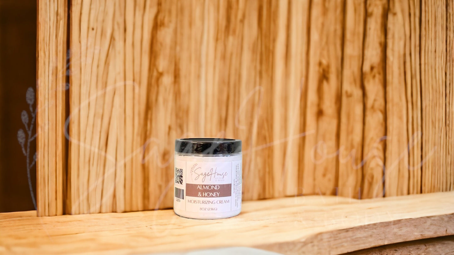A jar of Almond & Honey Moisturizing Cream against a wooden backdrop.