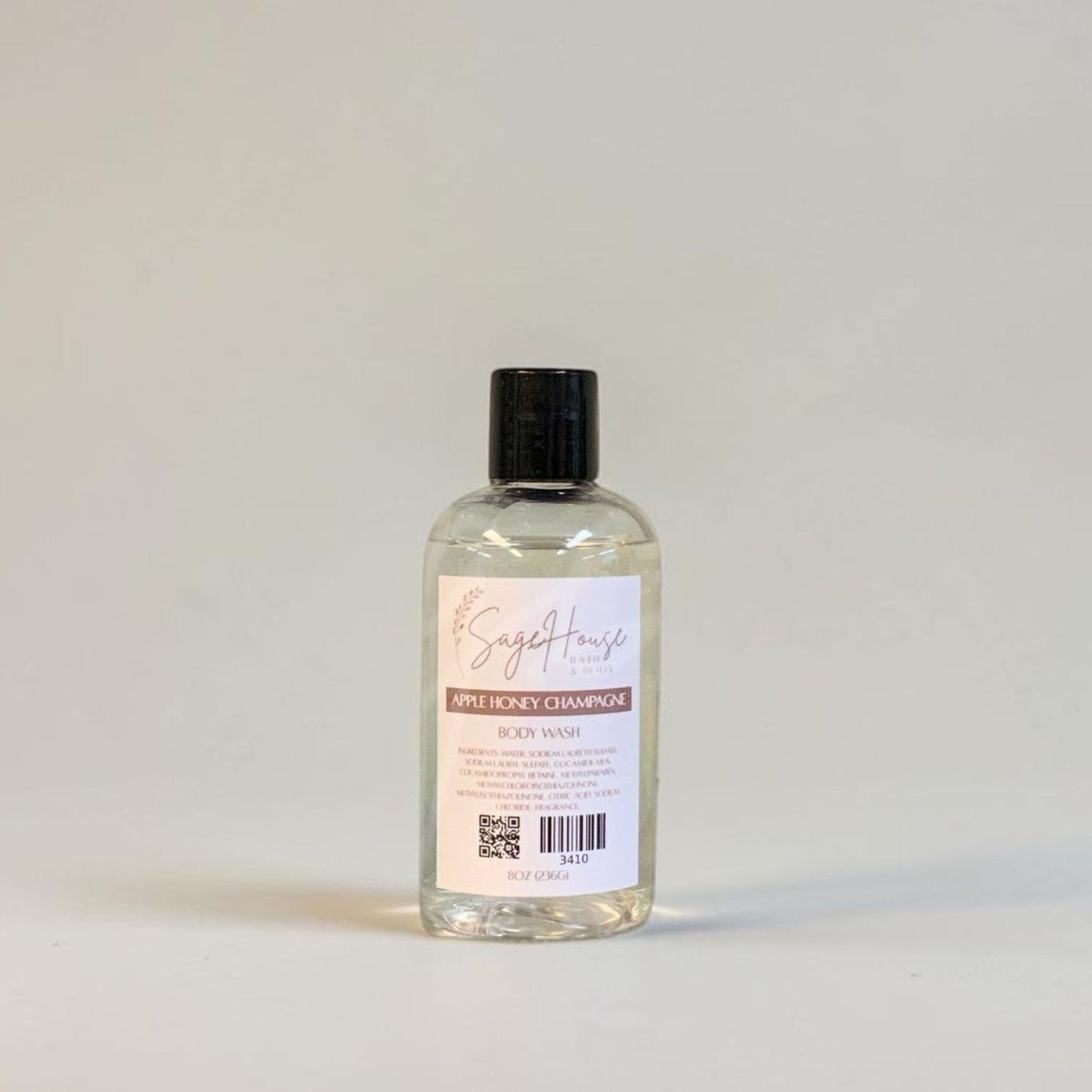 Clear bottle with black cap on a light gray background