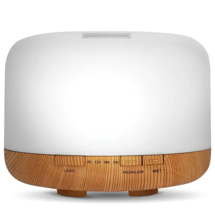 White and wooden essential oil diffuser on a white background