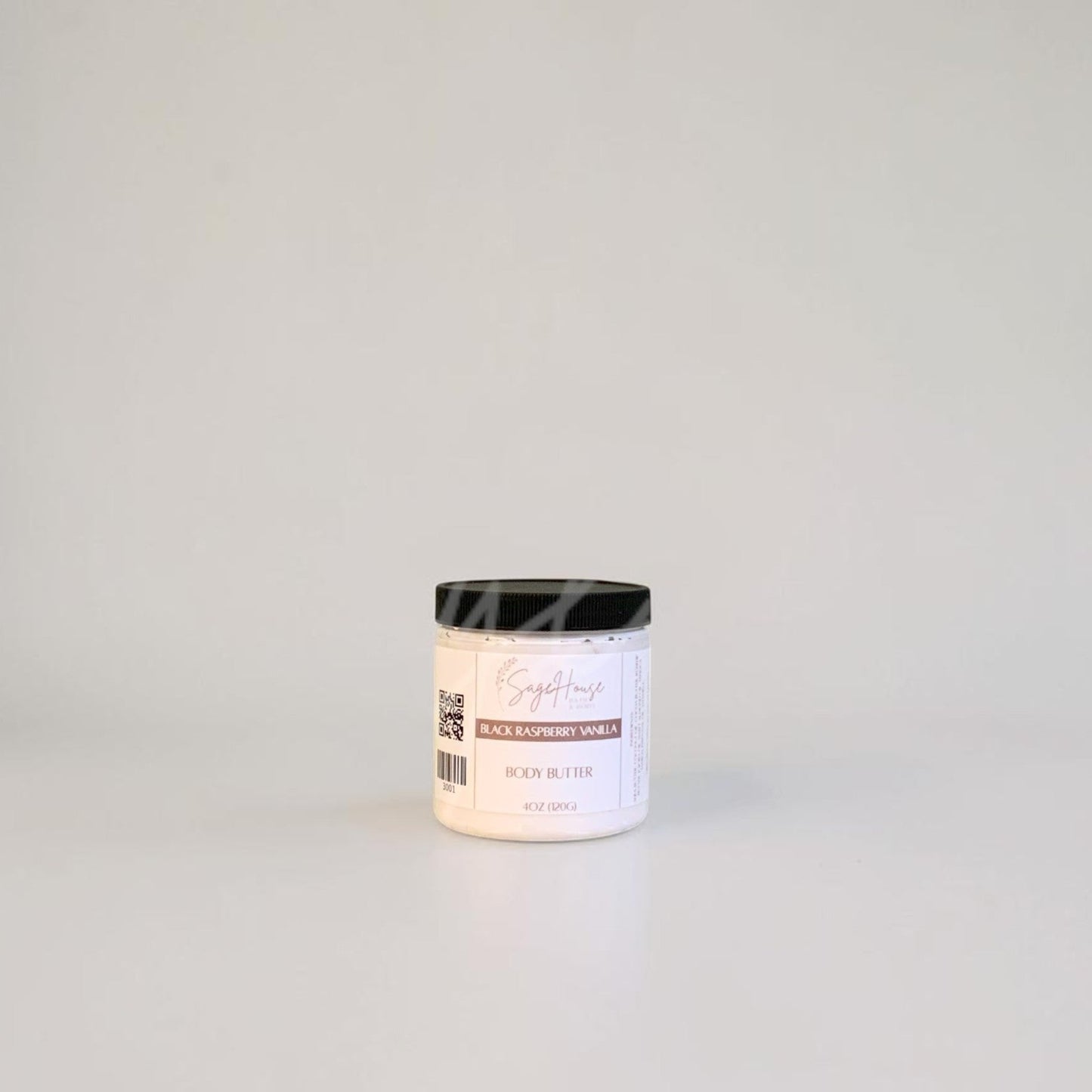 White container with black lid on a gray background