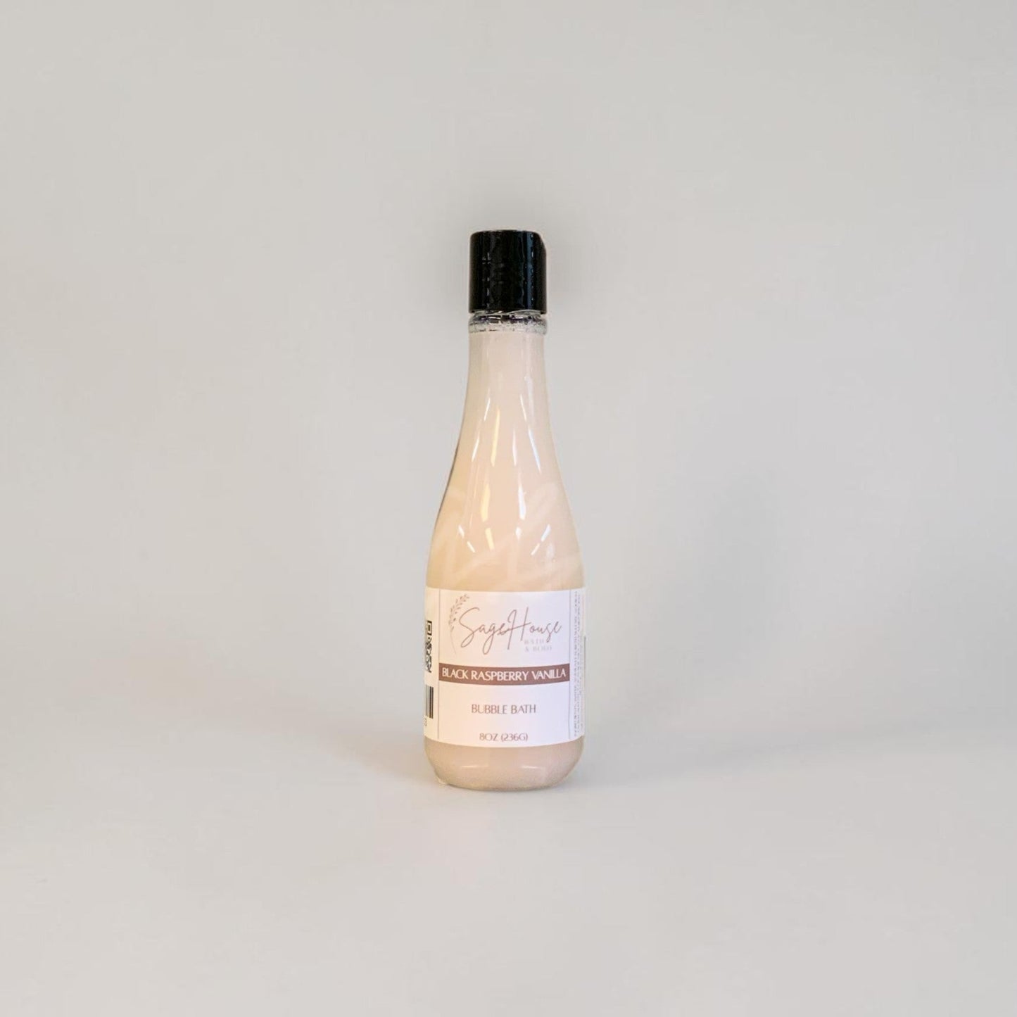 Bottle of bubble bath on a light gray background