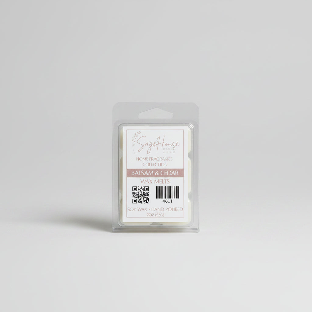 A clear clamshell container holding 6 wax melt cubes with a label on top, placed on a wooden surface against a wooden background.