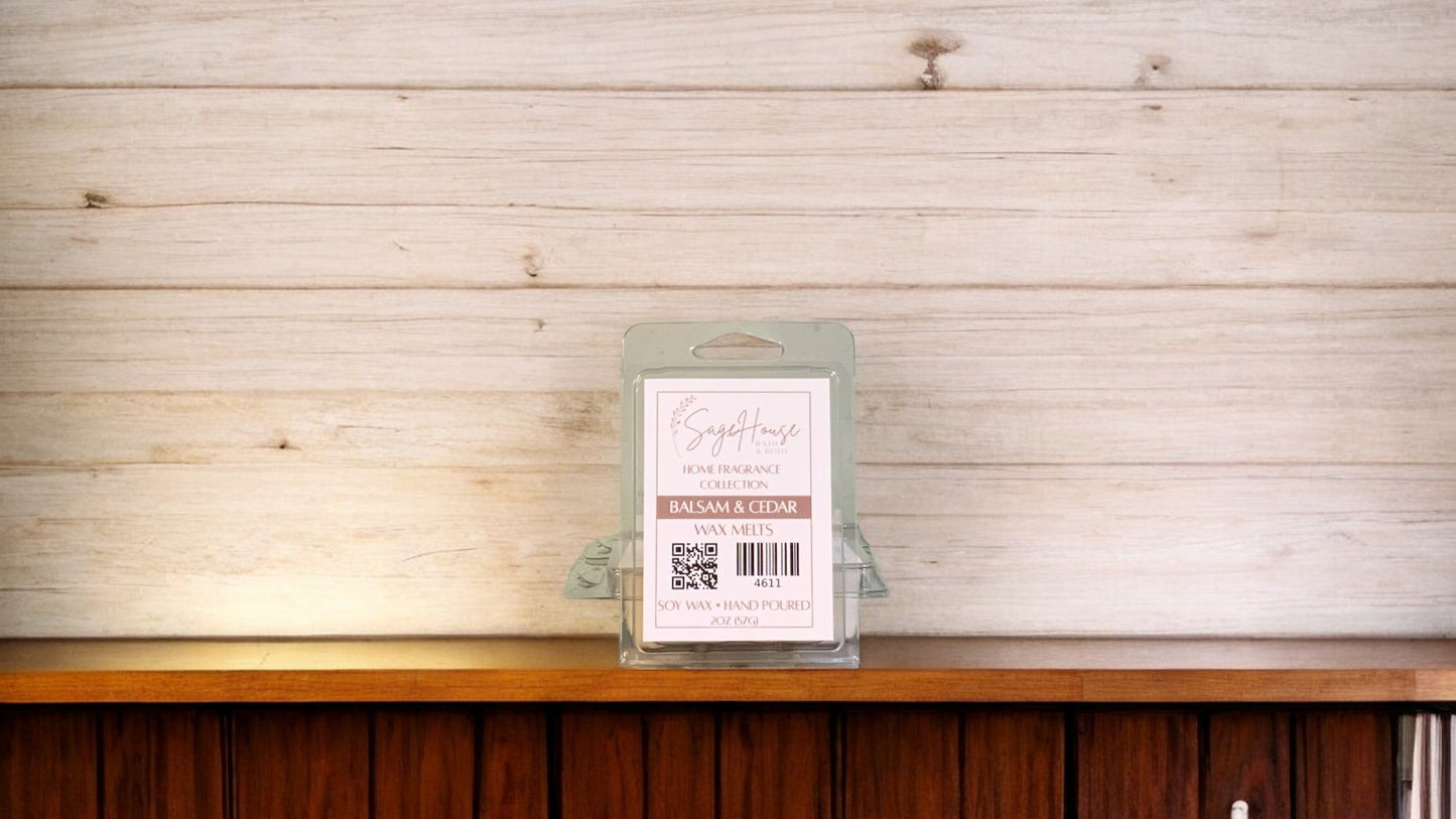 A clear clamshell container holding 6 wax melt cubes with a label on top, placed on a wooden surface against a wooden background.