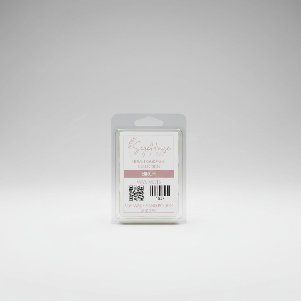 A clear clamshell container holding 6 wax melt cubes with a label on top, placed on a wooden surface against a wooden background.