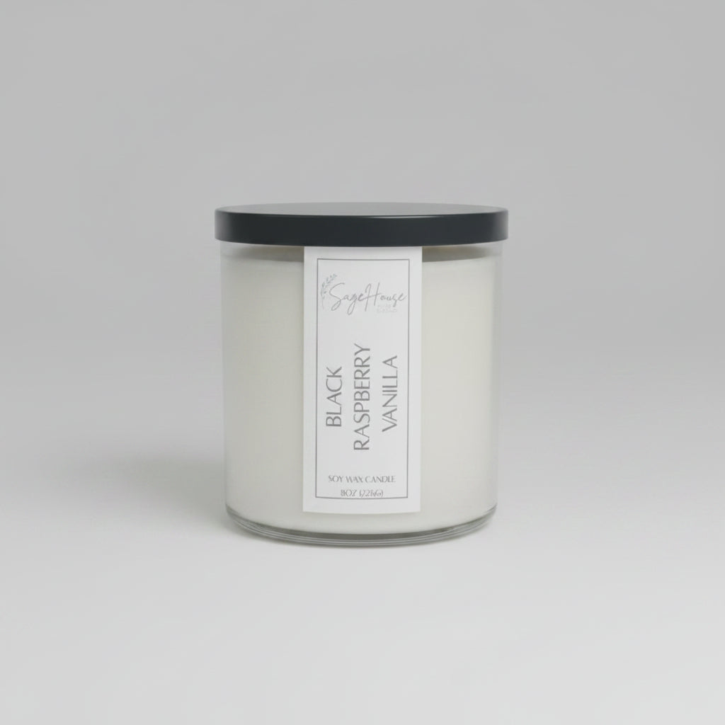 A white soy wax candle in a clear container, placed on a wooden surface, with a label on the front.