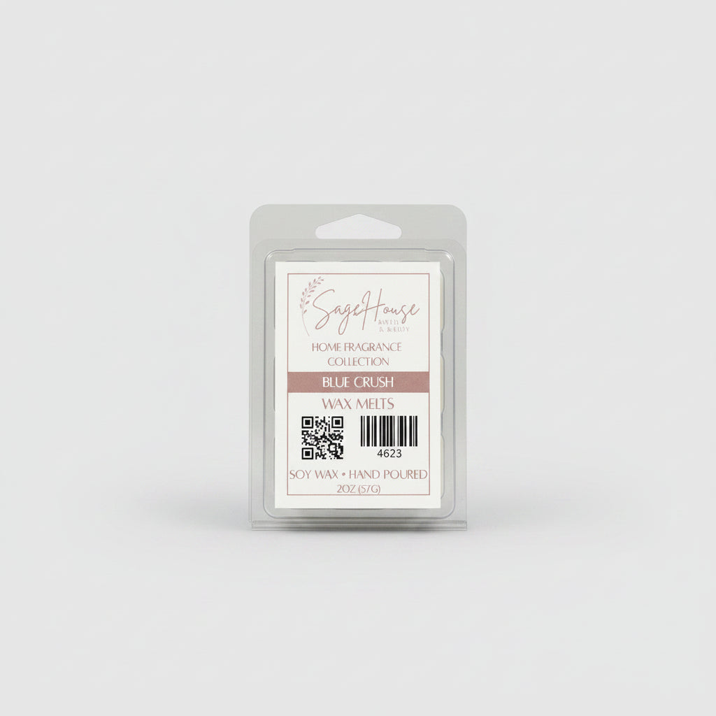 A clear clamshell container holding 6 wax melt cubes with a label on top, placed on a wooden surface against a wooden background.