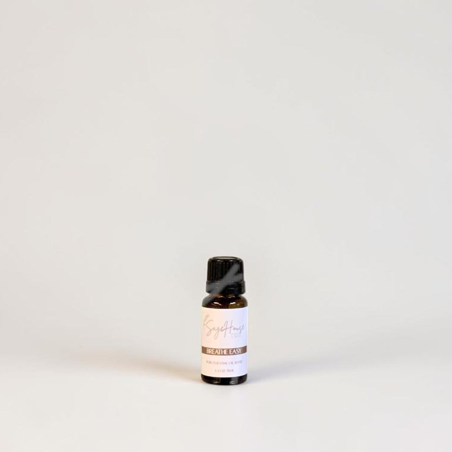 Amber bottle with label on a grey background.