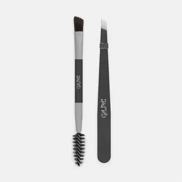 A brow grooming kit with a brush on one end and a pointed tool on the other, both with black and white color scheme.