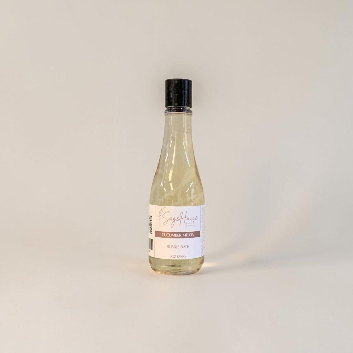 Bottle of bubble bath on a light gray background