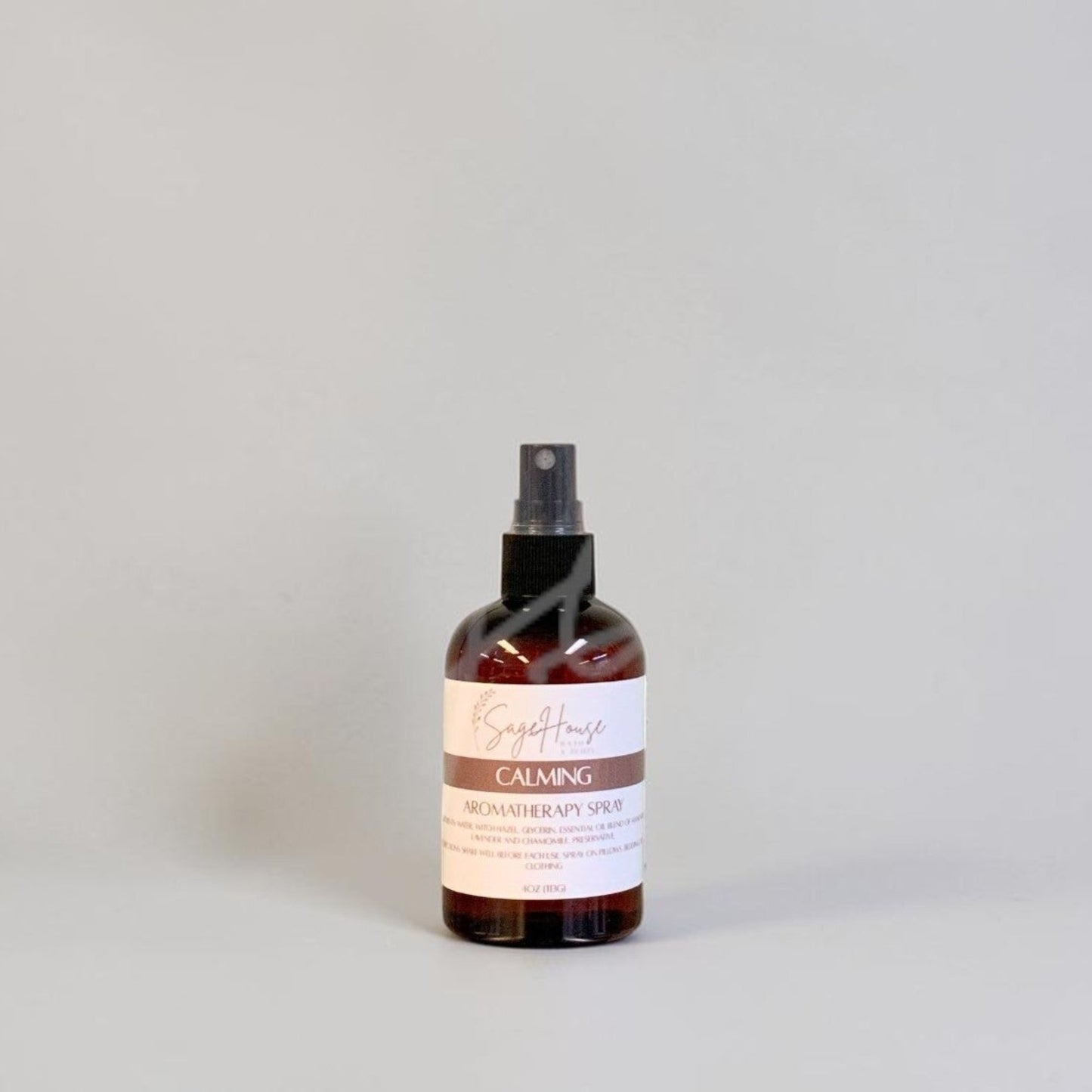 Bottle of a product with a label on a gray background