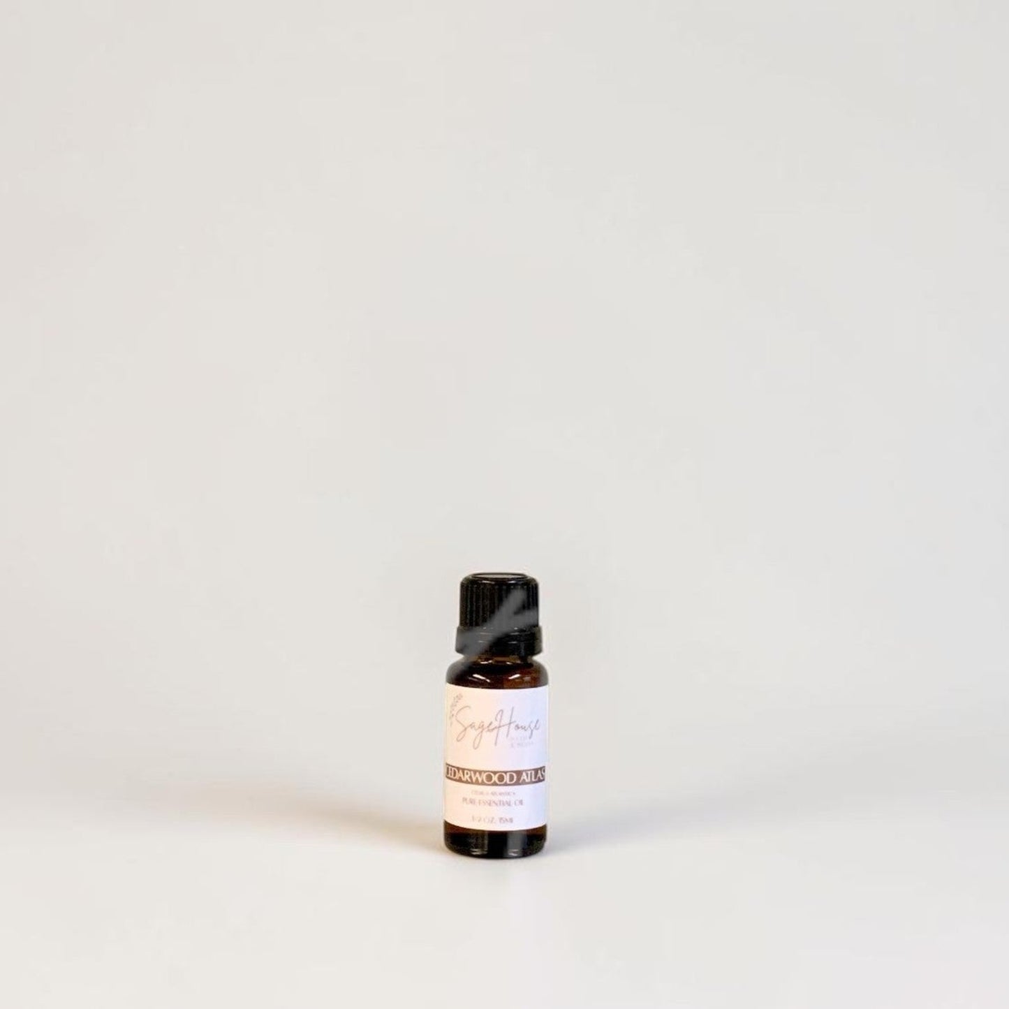 Amber bottle with label on a grey background.