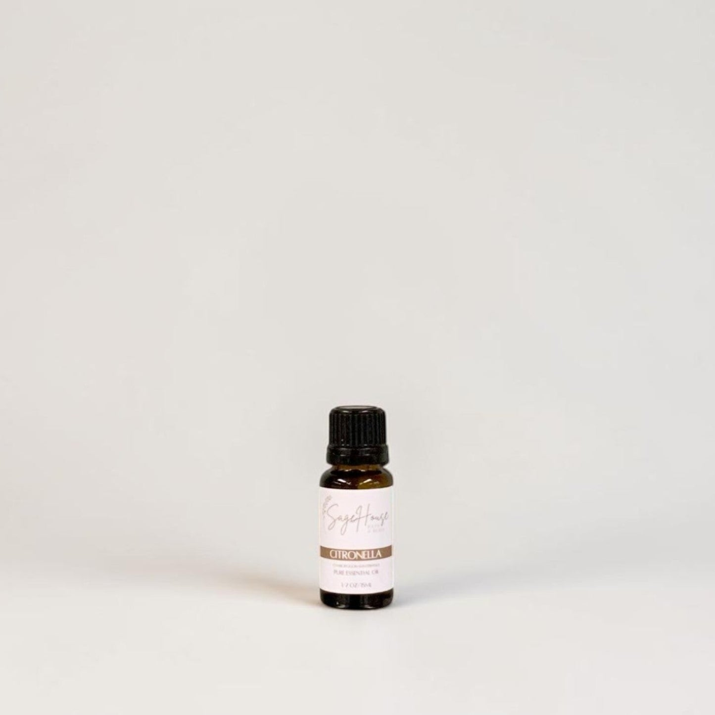Amber bottle with label on a grey background.