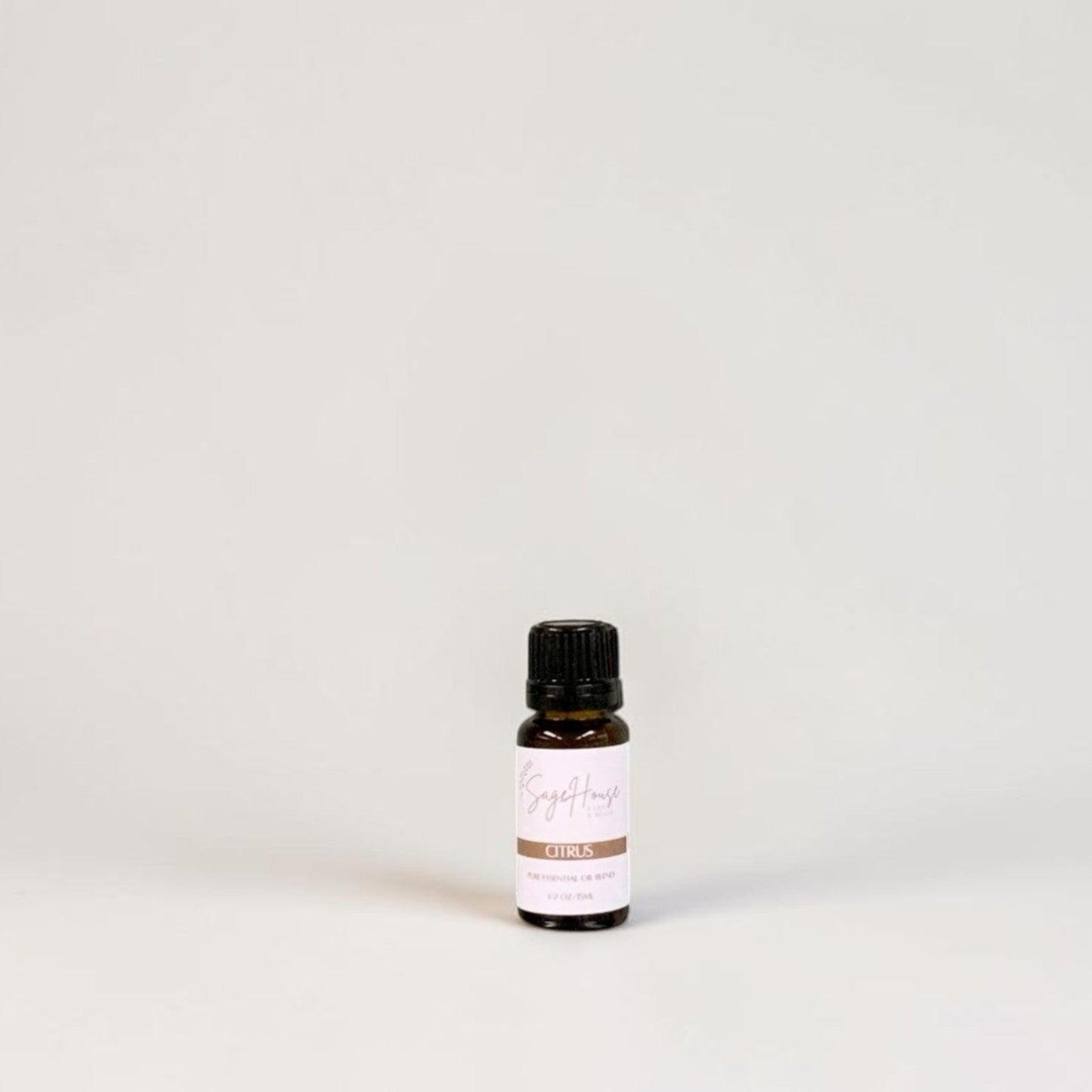Amber bottle with label on a grey background.
