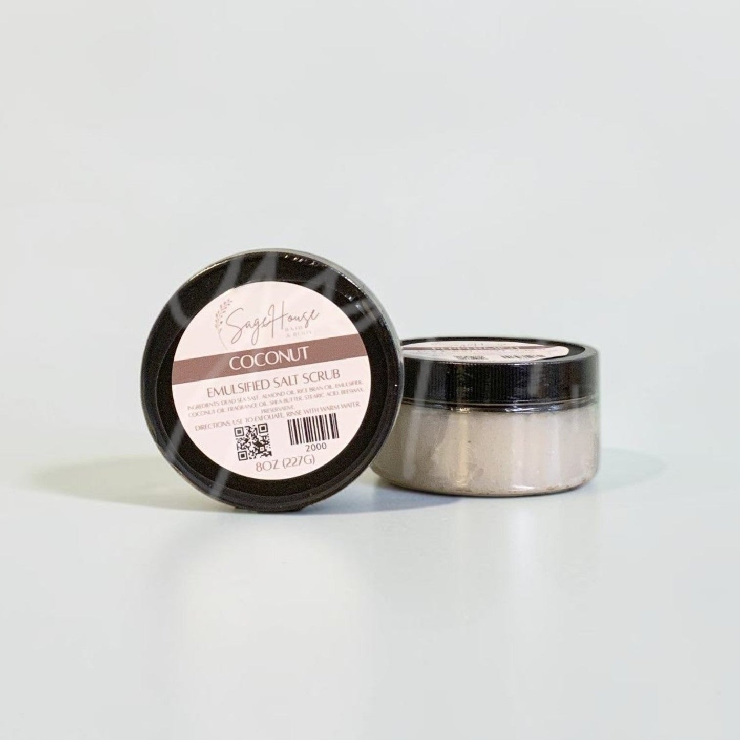 Two jars with black lids and white labels. On a white background.