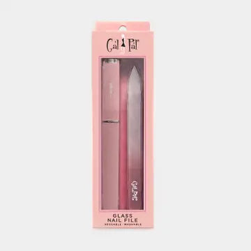 A coral color glass nail file with case inside of packaging, on a white background