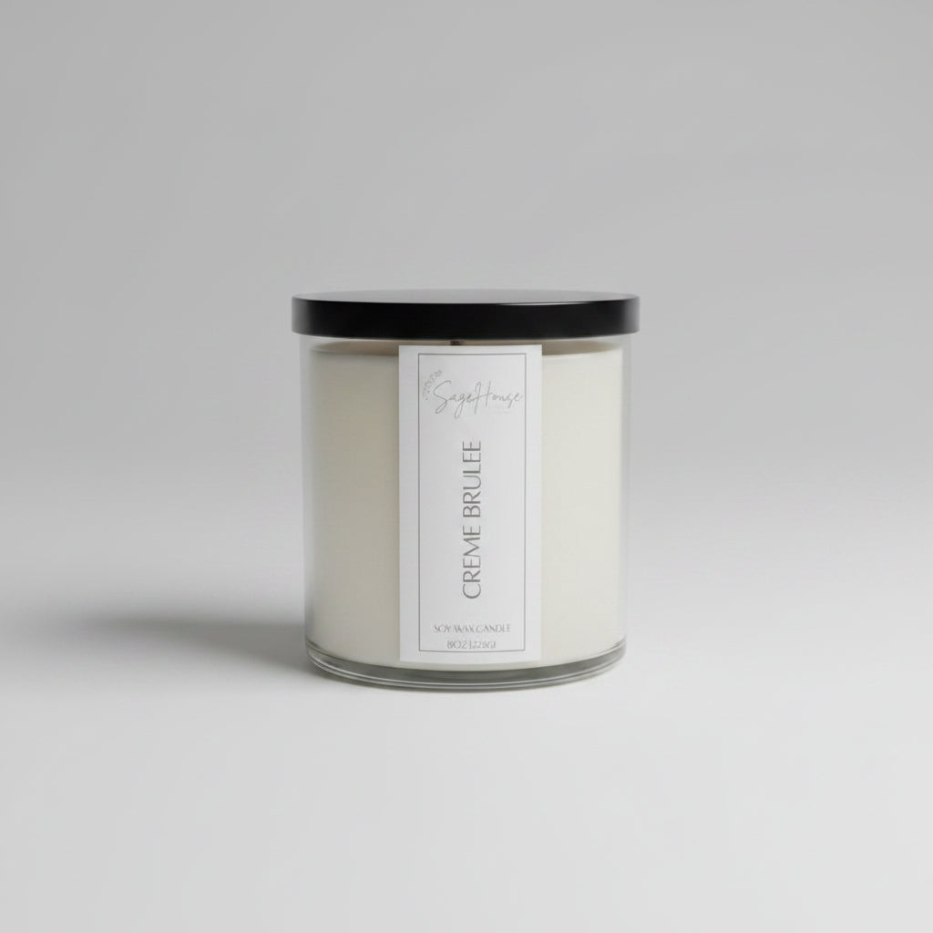 A white soy wax candle in a clear container, placed on a wooden surface, with a label on the front.