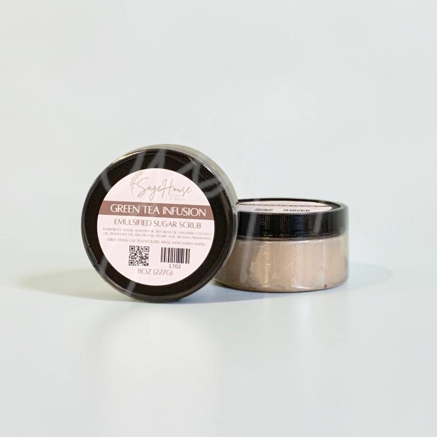Two jars with black lids and white labels. On a white background.