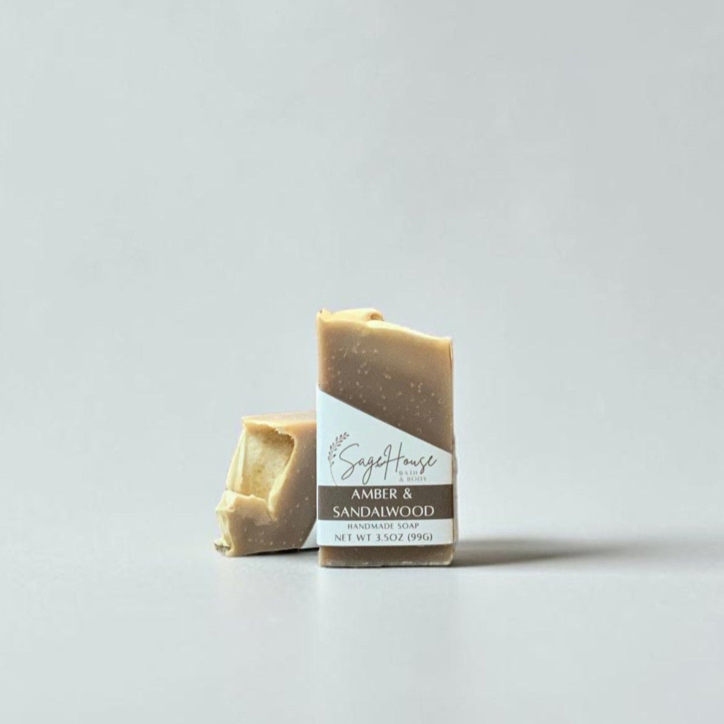 Bar of soap with a label on a light gray background