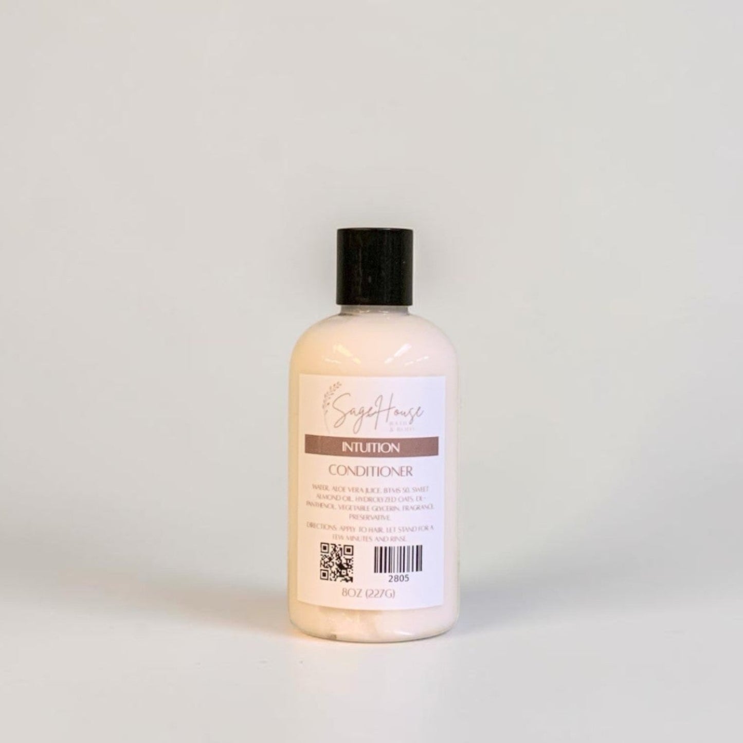 A bottle of conditioner on a white background.