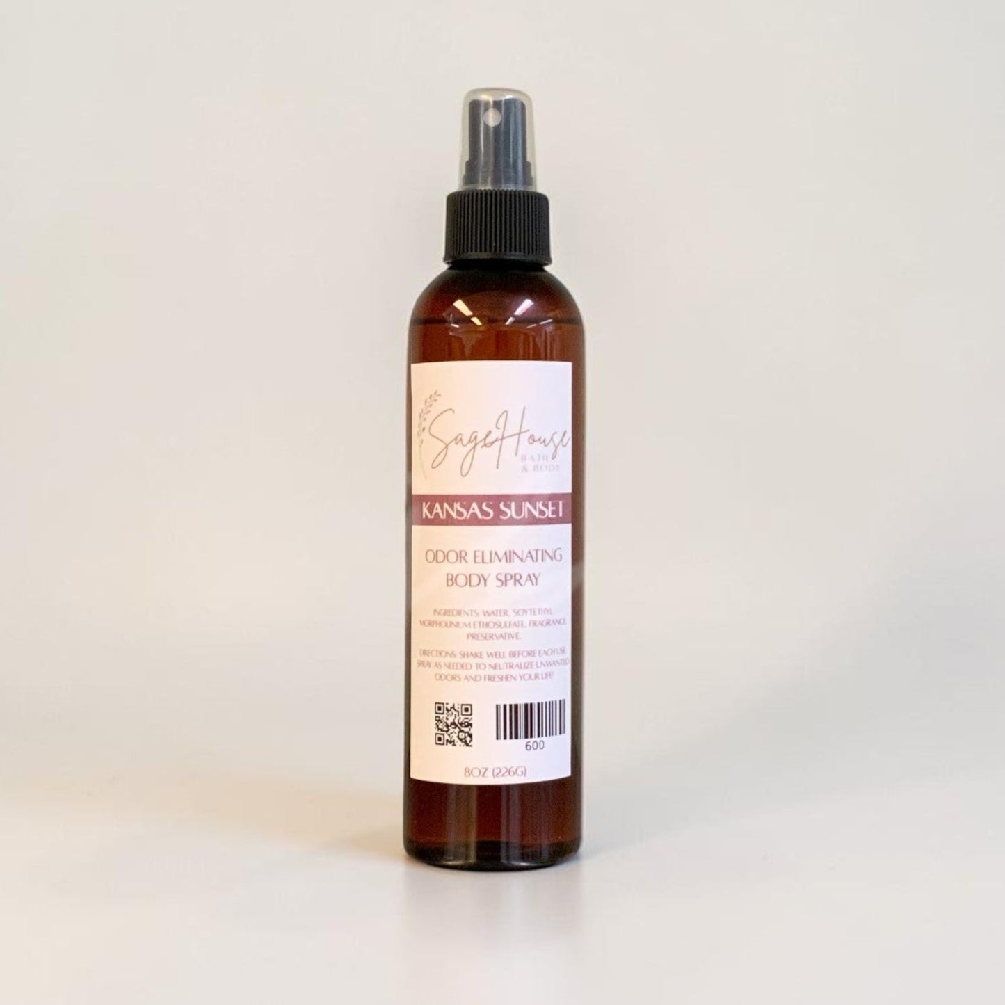 Bottle of body spray on a white background