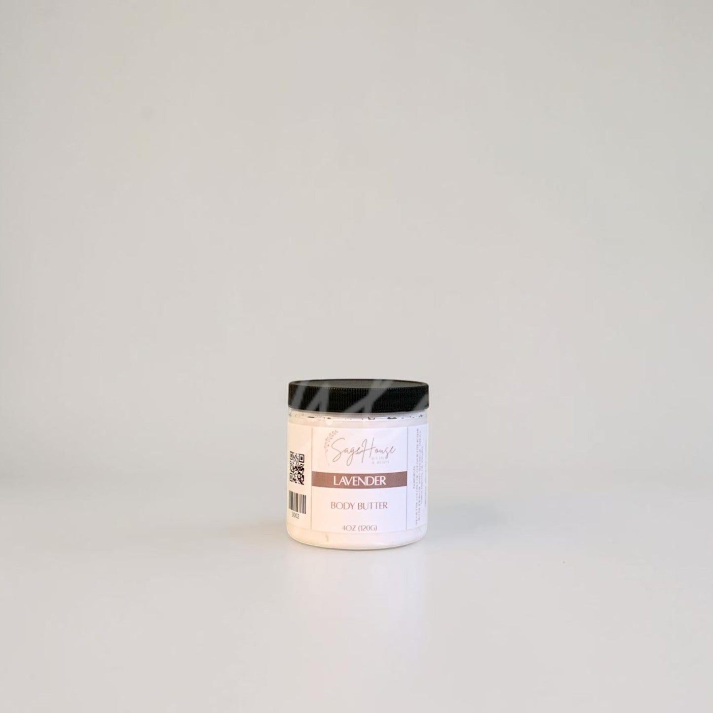 White container with black lid on a gray background
