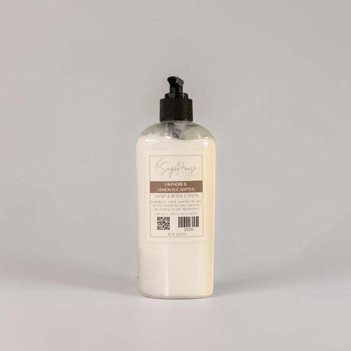 A large bottle of lotion with black pump top and white label. On a white background.