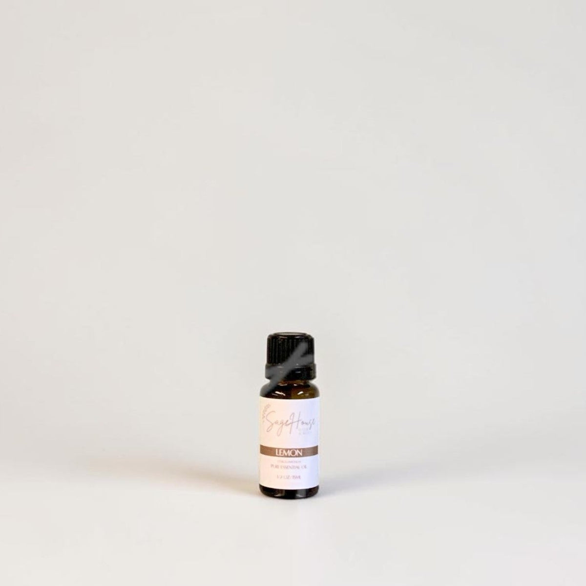 Amber bottle with label on a grey background.