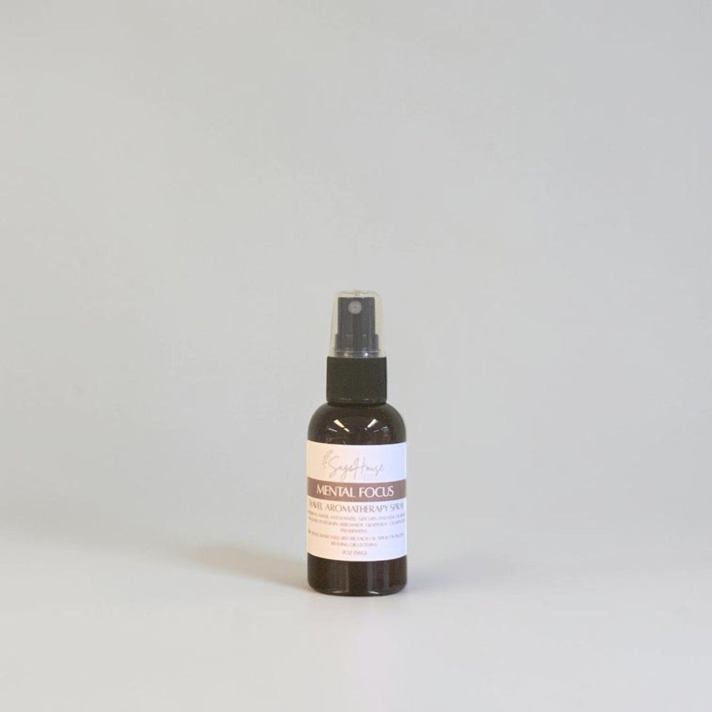 Spray bottle with a label on a white background