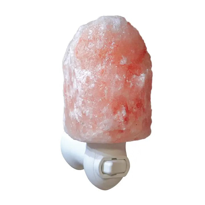 A natural shaped salt lamp fitted onto a plug in switch