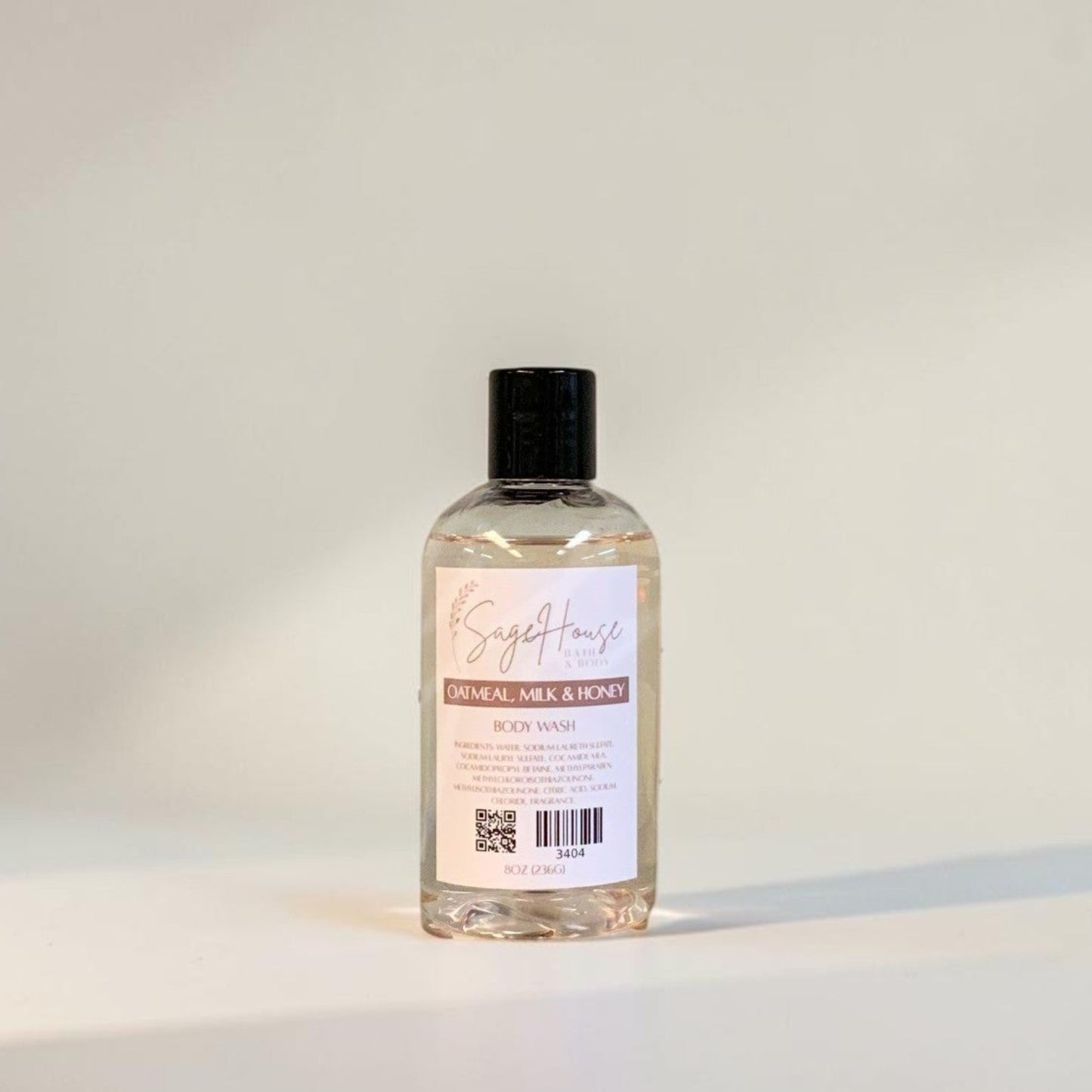 Clear bottle with black cap on a light gray background