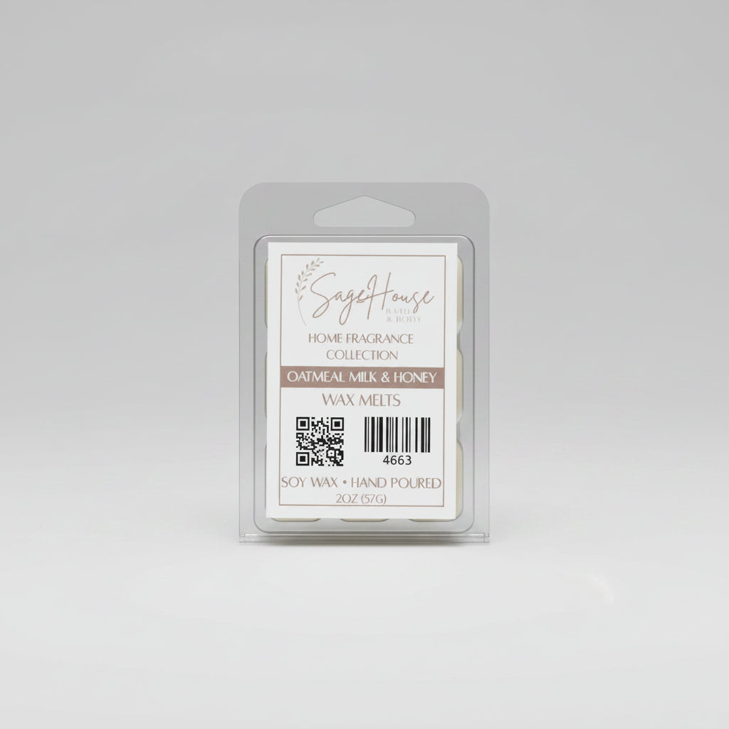 A clear clamshell container holding 6 wax melt cubes with a label on top, placed on a wooden surface against a wooden background.