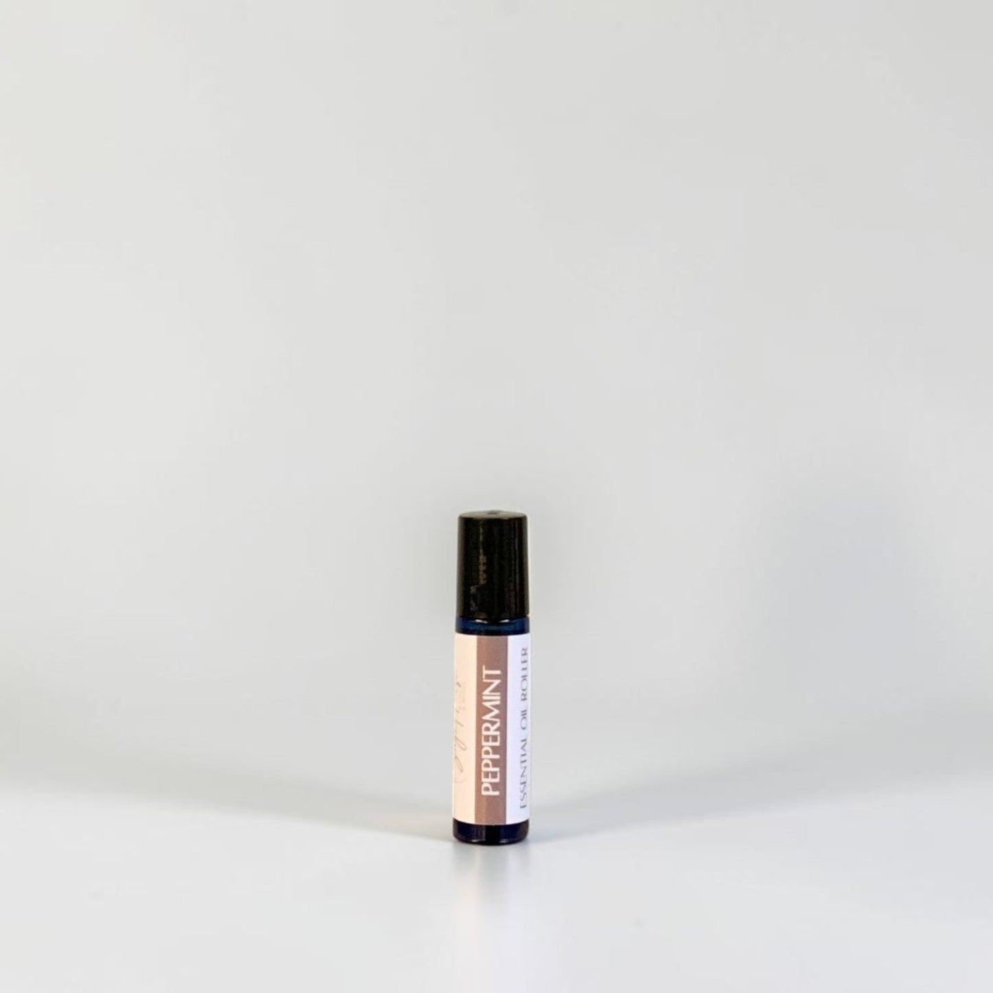 A roller bottle with label. On a white background.
