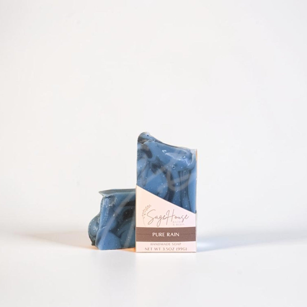 A labeled bar of soap sitting in front of a matching bar. On a white background.