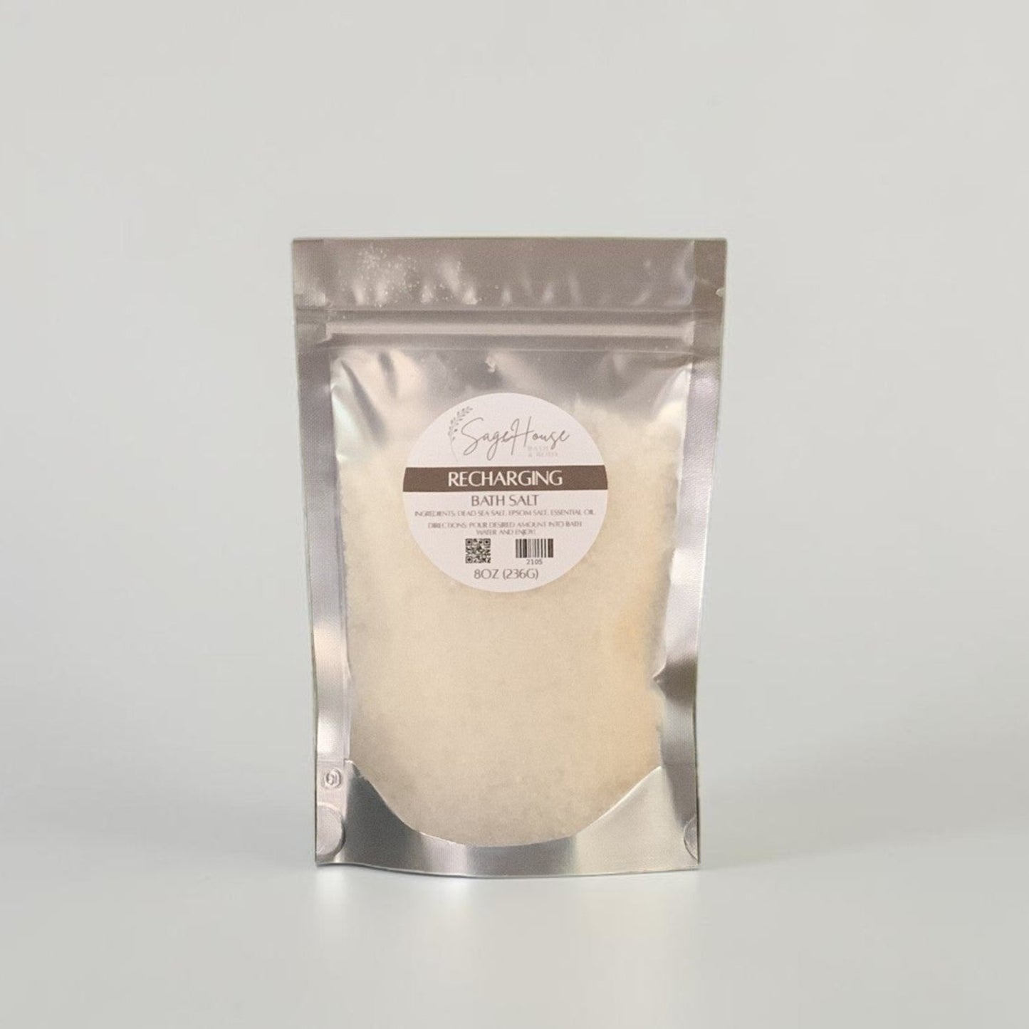 Silver package with a label, on a grey background.