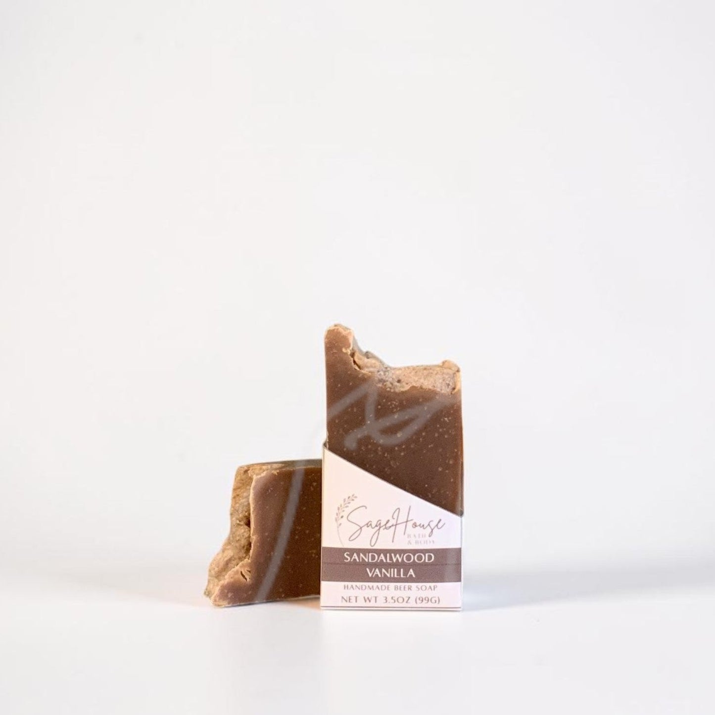 A labeled bar of soap sitting in front of a matching bar. On a white background.