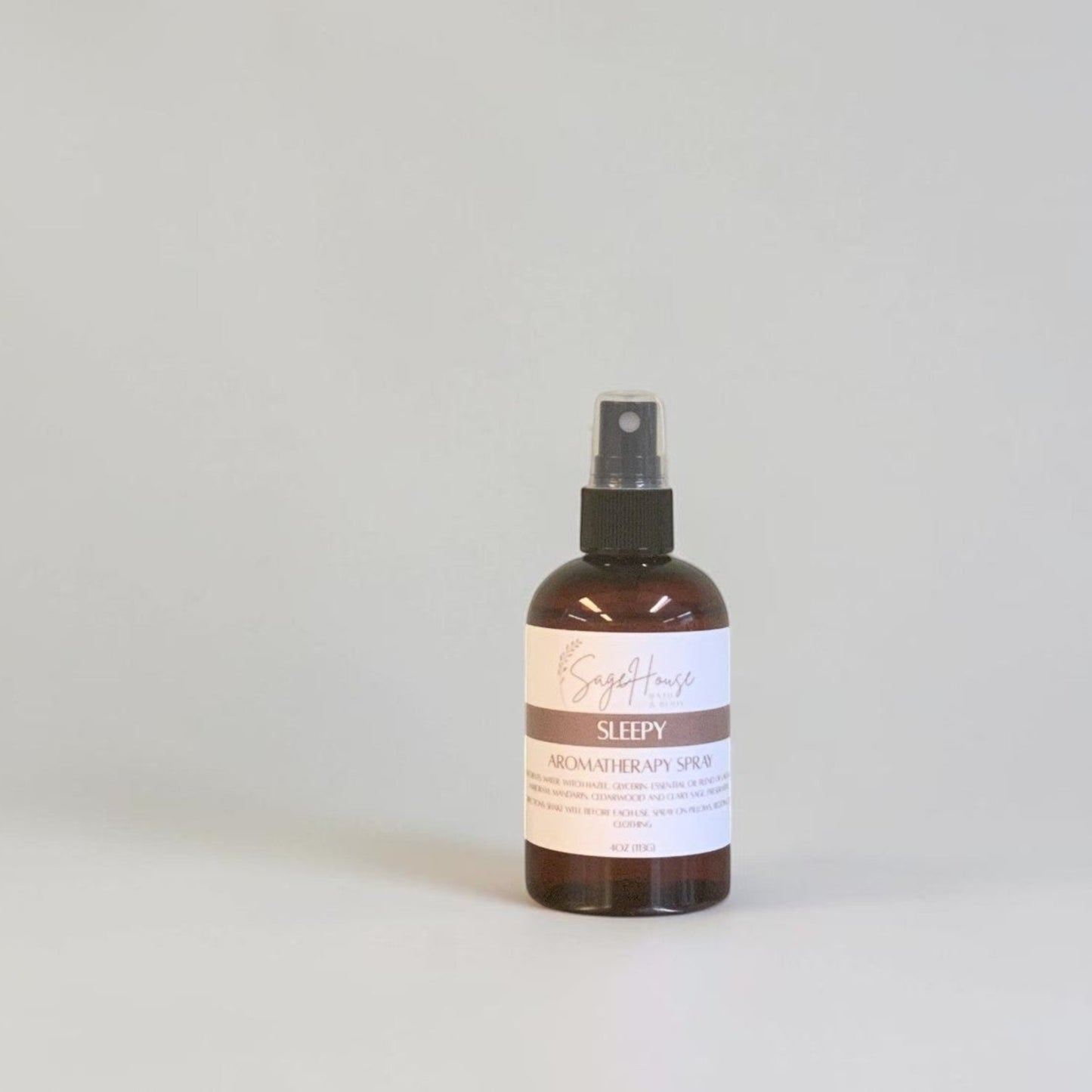 Brown bottle with label on a gray background.
