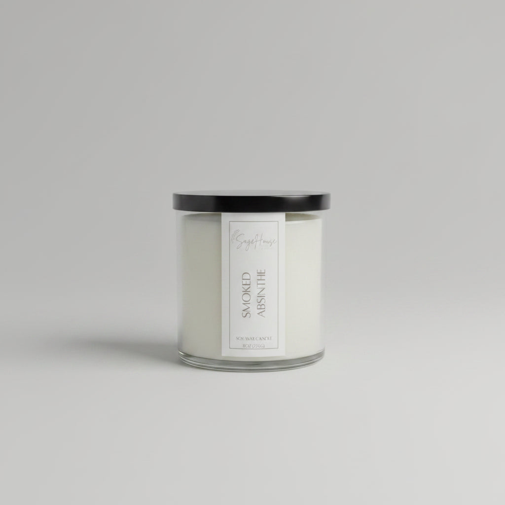 A white soy wax candle in a clear container, placed on a wooden surface, with a label on the front.