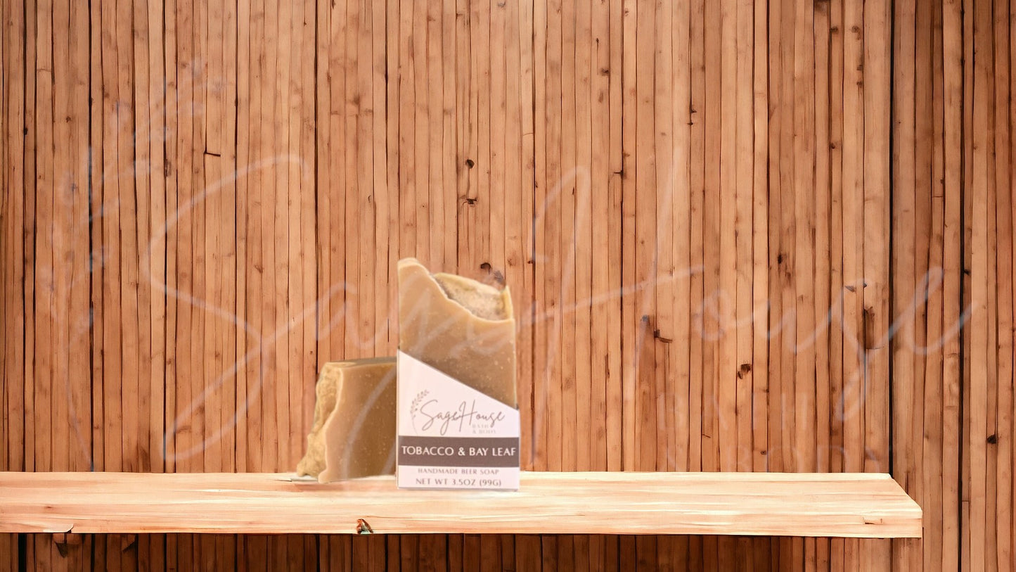 A tan colored bar of soap with a white label. on a wood surface.