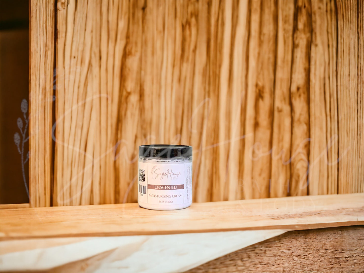 A jar of Unscented Moisturizing Cream with a wood background