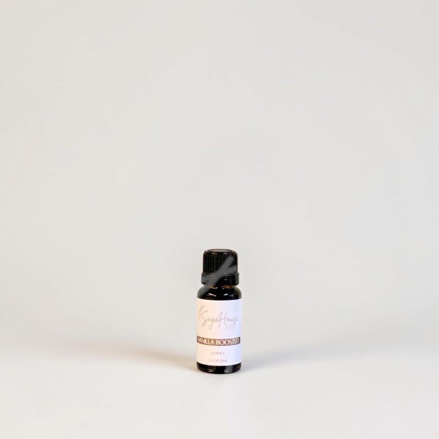 Amber bottle with label on a grey background.