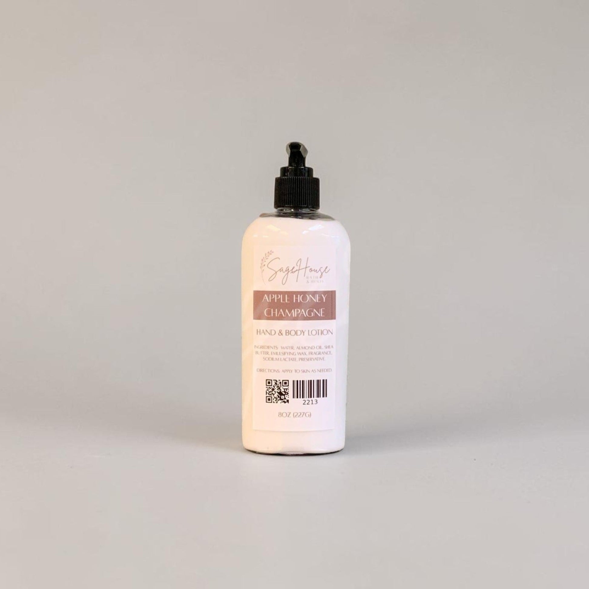 A large bottle of lotion with black pump top and white label. On a white background.