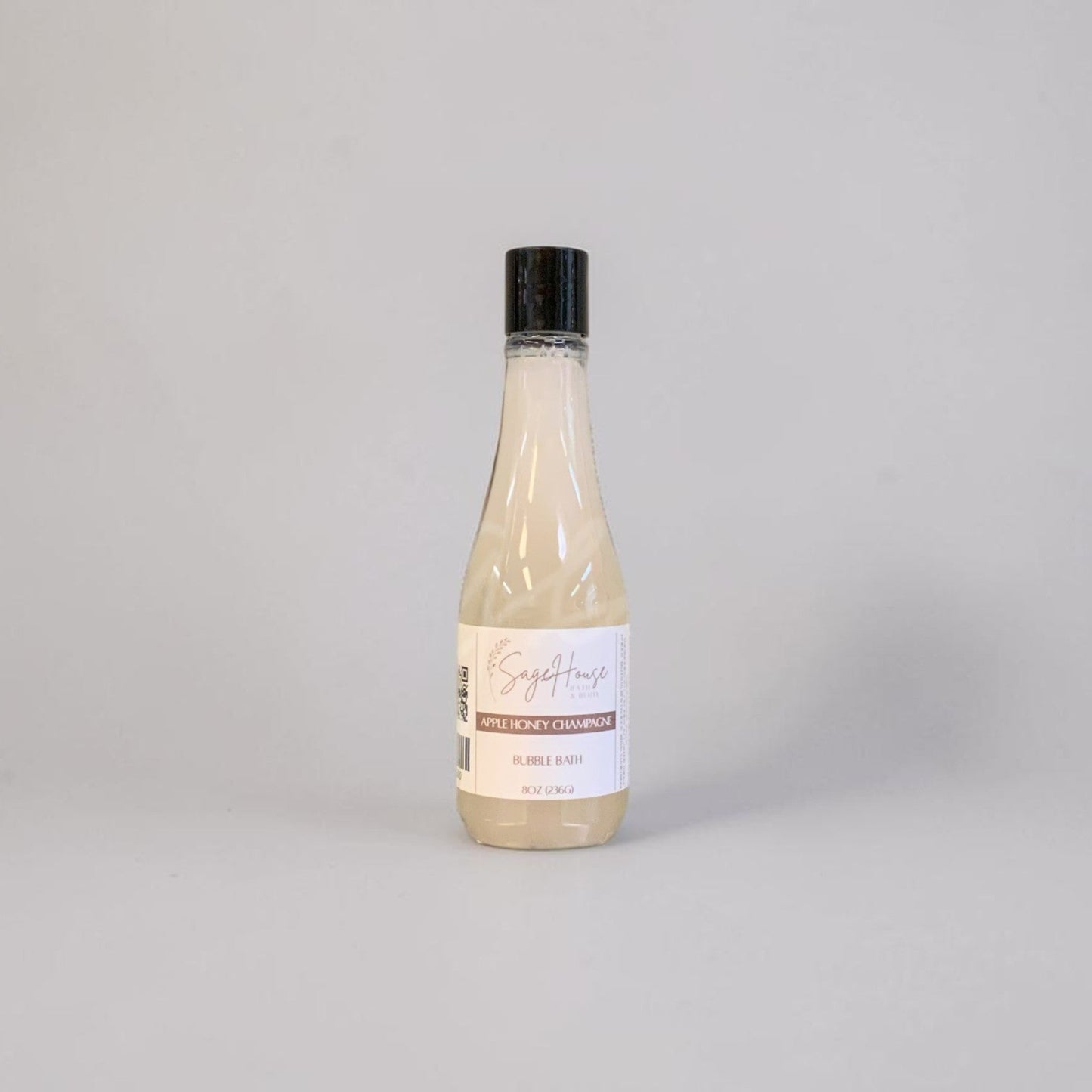 Bottle of bubble bath on a light gray background