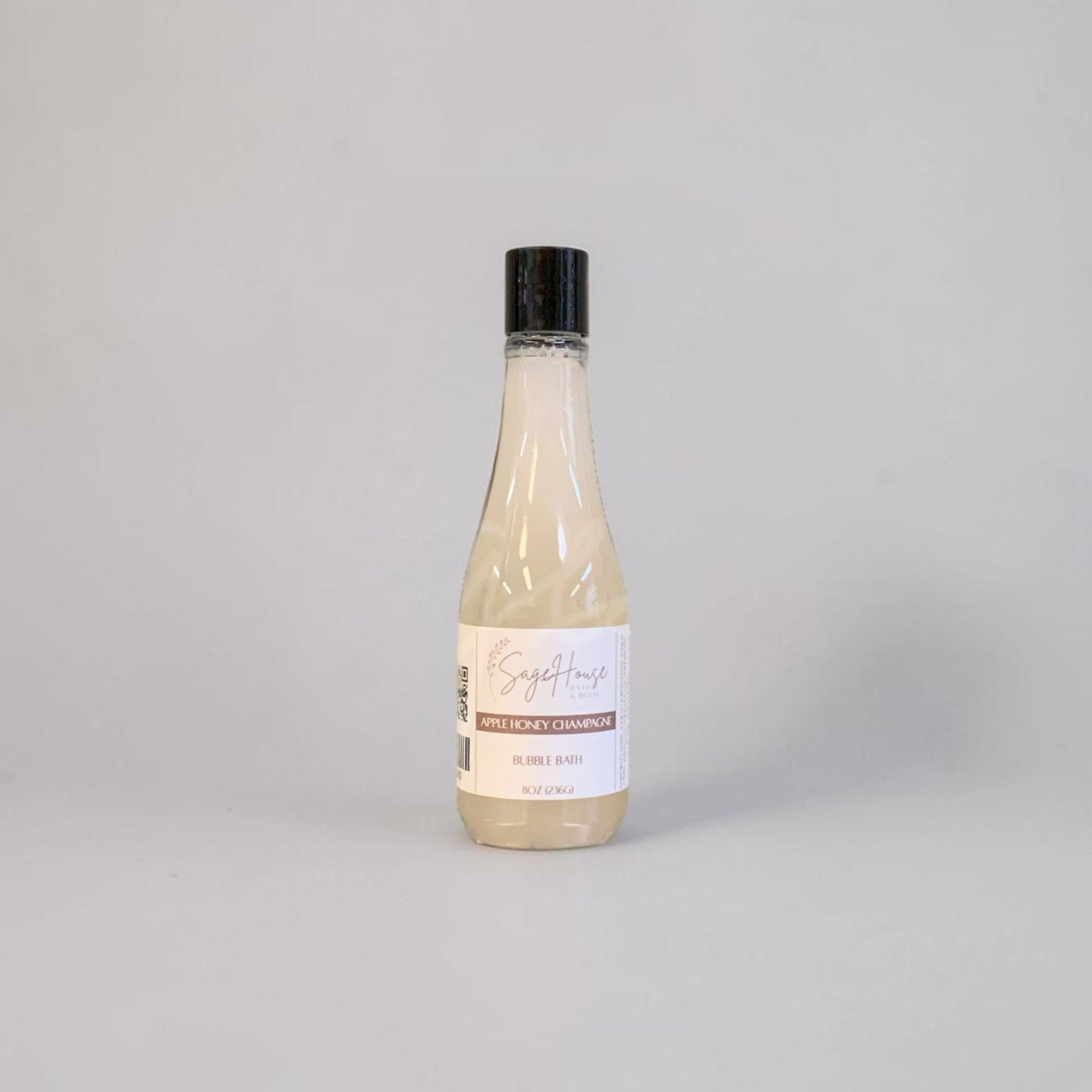 Bottle of bubble bath on a light gray background
