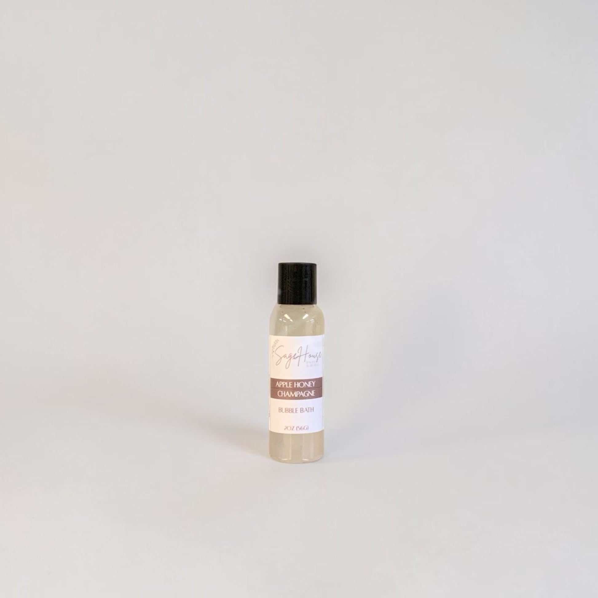 Small bottle with a black cap and label on a light gray background