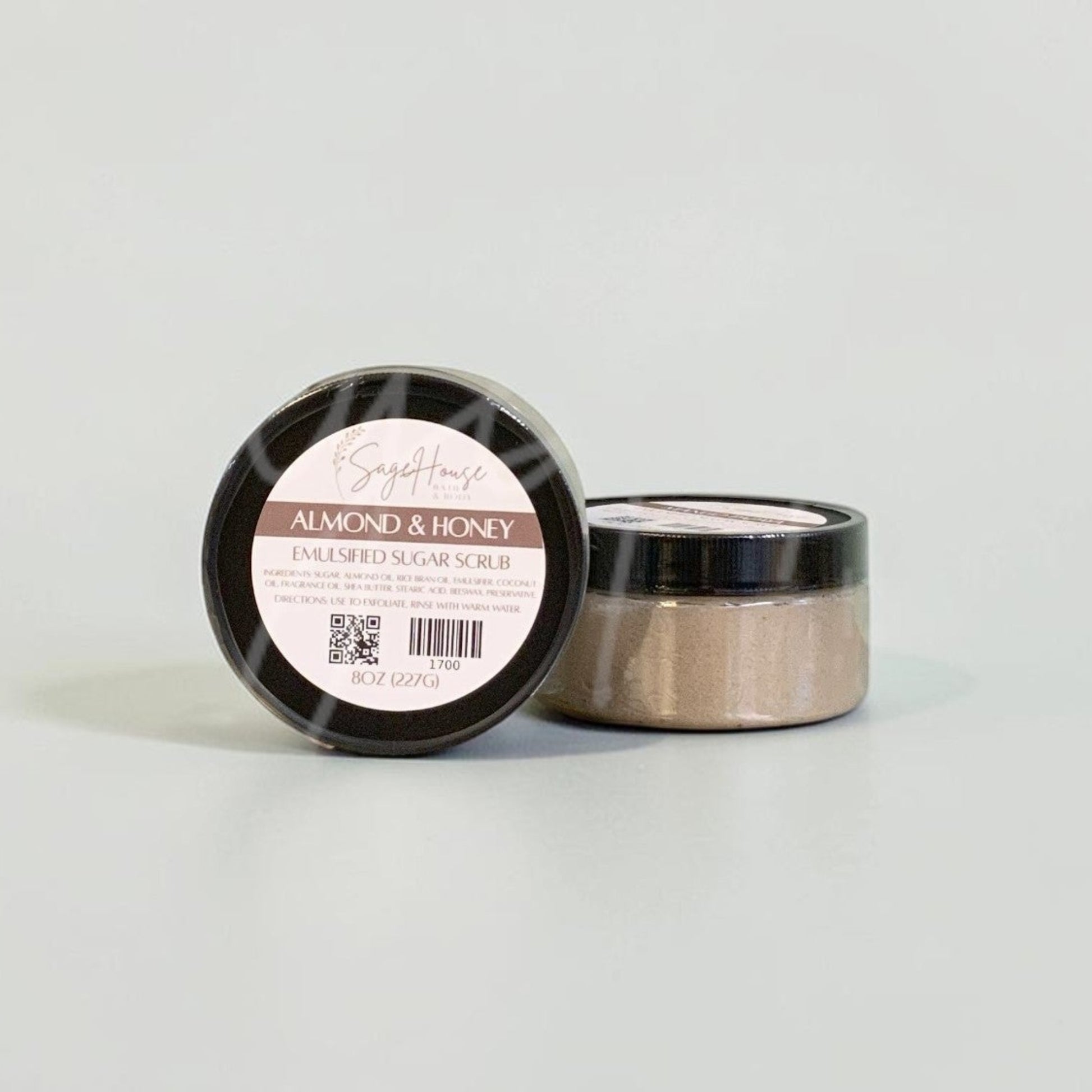 Two jars with black lids and white labels. On a white background.
