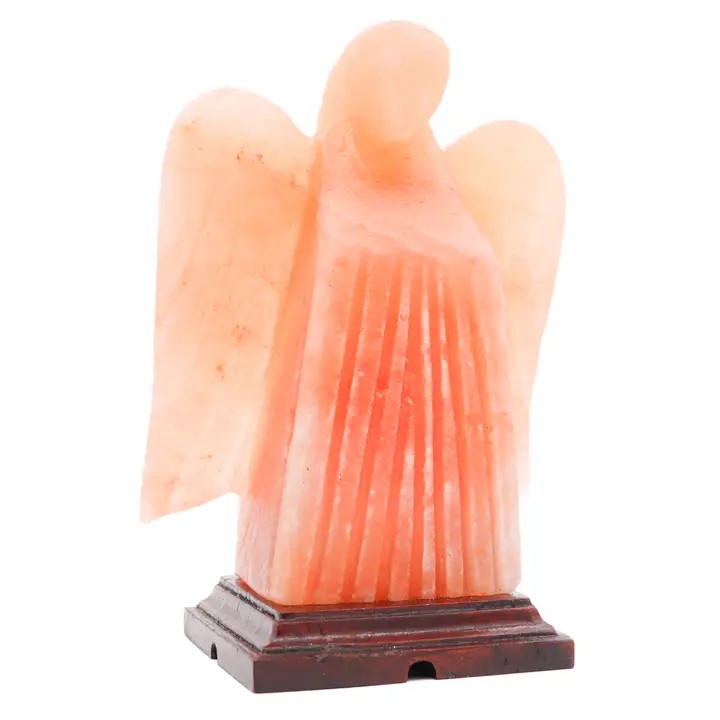 An angel-shaped Himalayan salt lamp with a pink color.