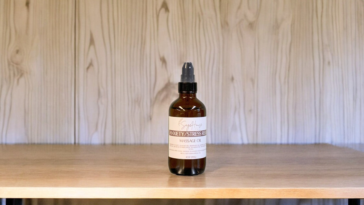 A Bottle with a treatment pump, labeled with 'Anxiety/Stress Relief Massage Oil', positioned on a wooden surface.