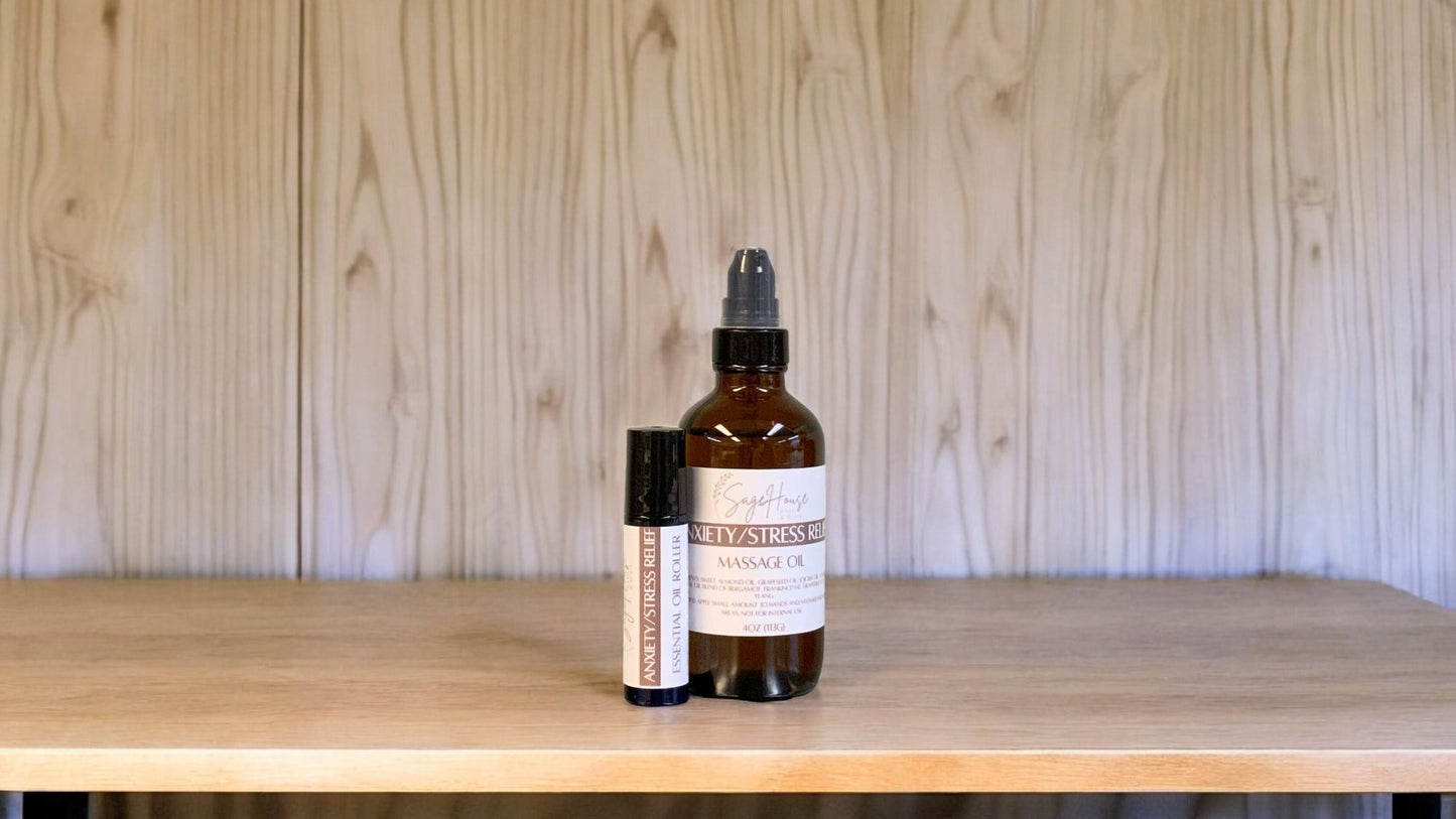 A bottle with a treatment pump, and roller bottle labeled with 'Anxiety/Stress Relief Massage Oil', positioned on a wooden surface.