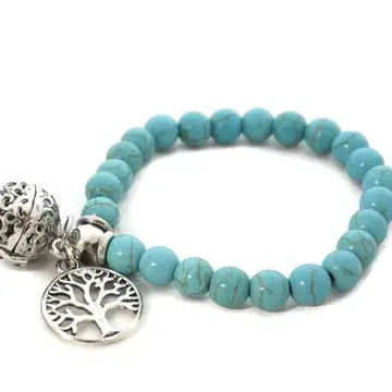 bracelet with turquoise beads, with lava bead inside of silver ball and chakra tree attached.