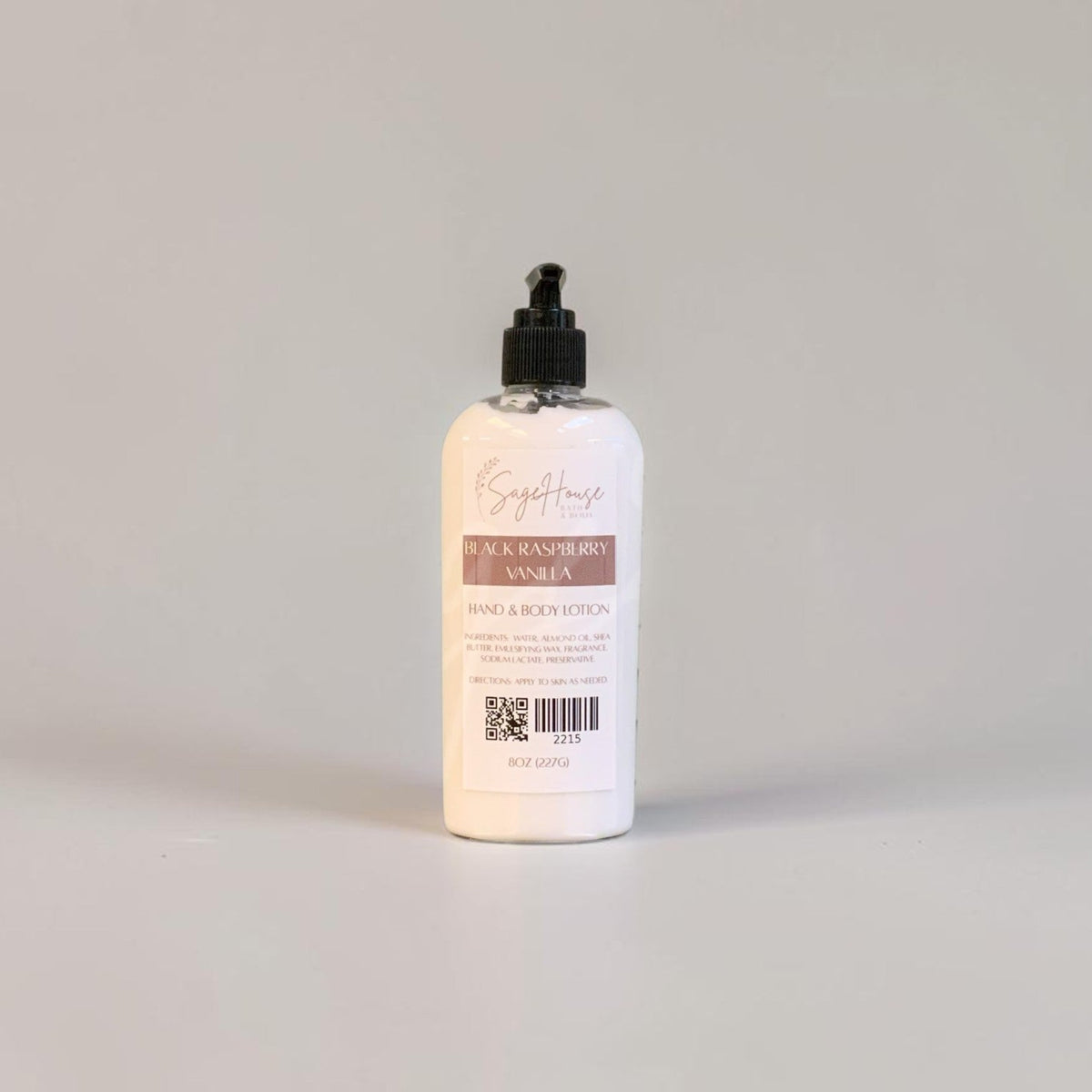 A large bottle of lotion with black pump top and white label. On a white background.